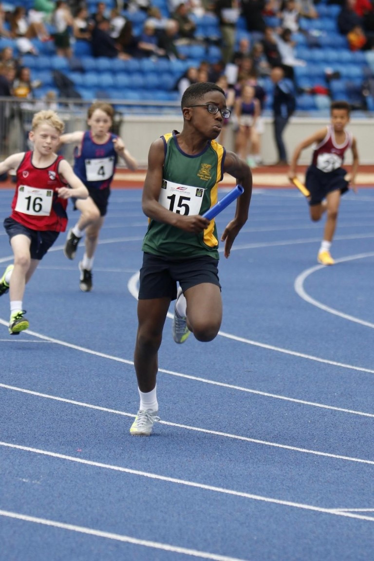 Heath Mount boy races in the 4x100m relay at the Alexander Stadium