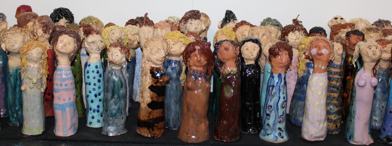 Over 60 painted figures featured in a group with different clothing, hairstyles and features