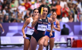 Jodie Williams carries the baton as she runs a leg of the women's 4x400m relay at the Olympics