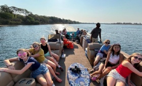 Year 8 pupils enjoy the views from a boat safari on the Zambezi River